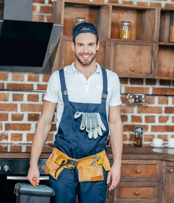 professional-home-master-with-toolbox-and-tool-belt-smiling-at-camera.jpg